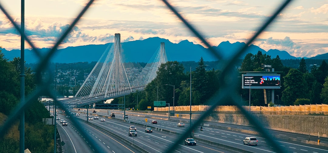 a view of a highway through a fence Surrey Local