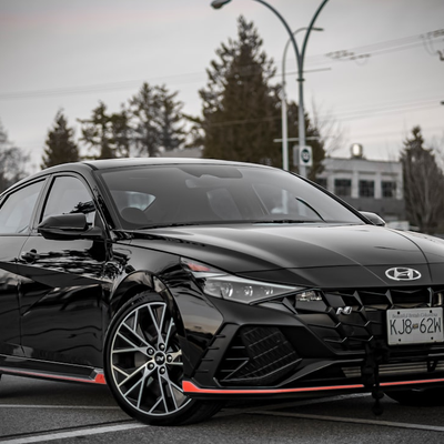 Automotive: Sales and Service in Surrey Black Hyundai Elantra N in a Surrey parking lot.
