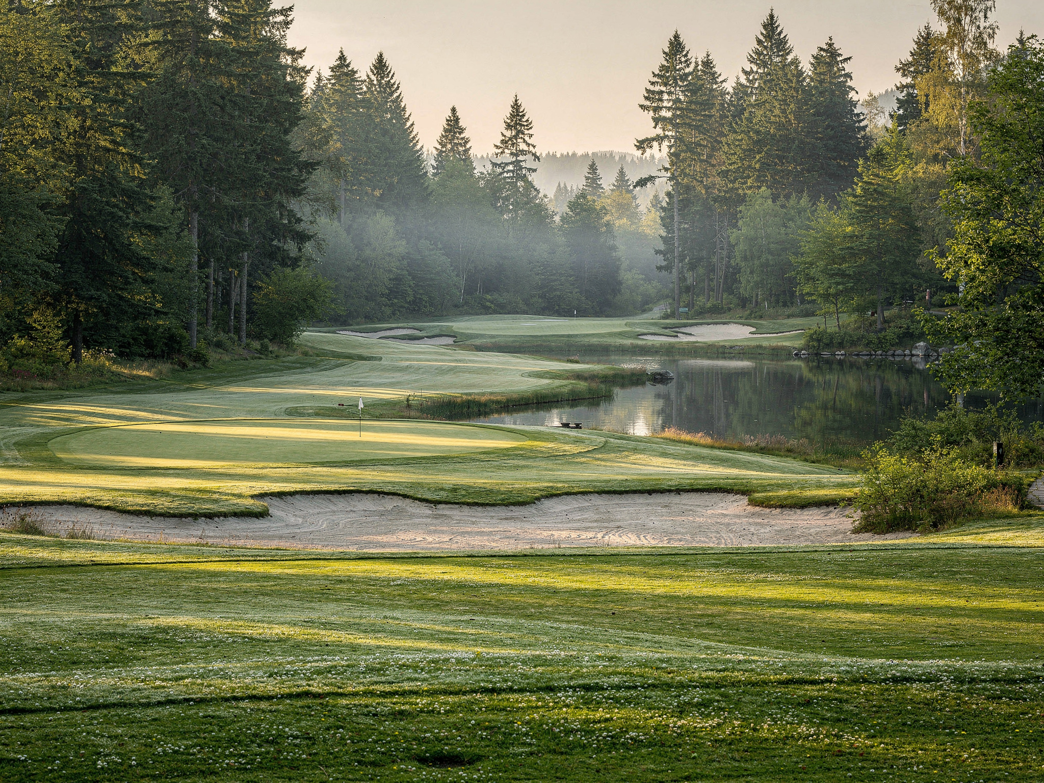 golf courses in surrey v2 Best Surrey Golf Courses Golf course fairway with pond and sand bunkers in Surrey BC