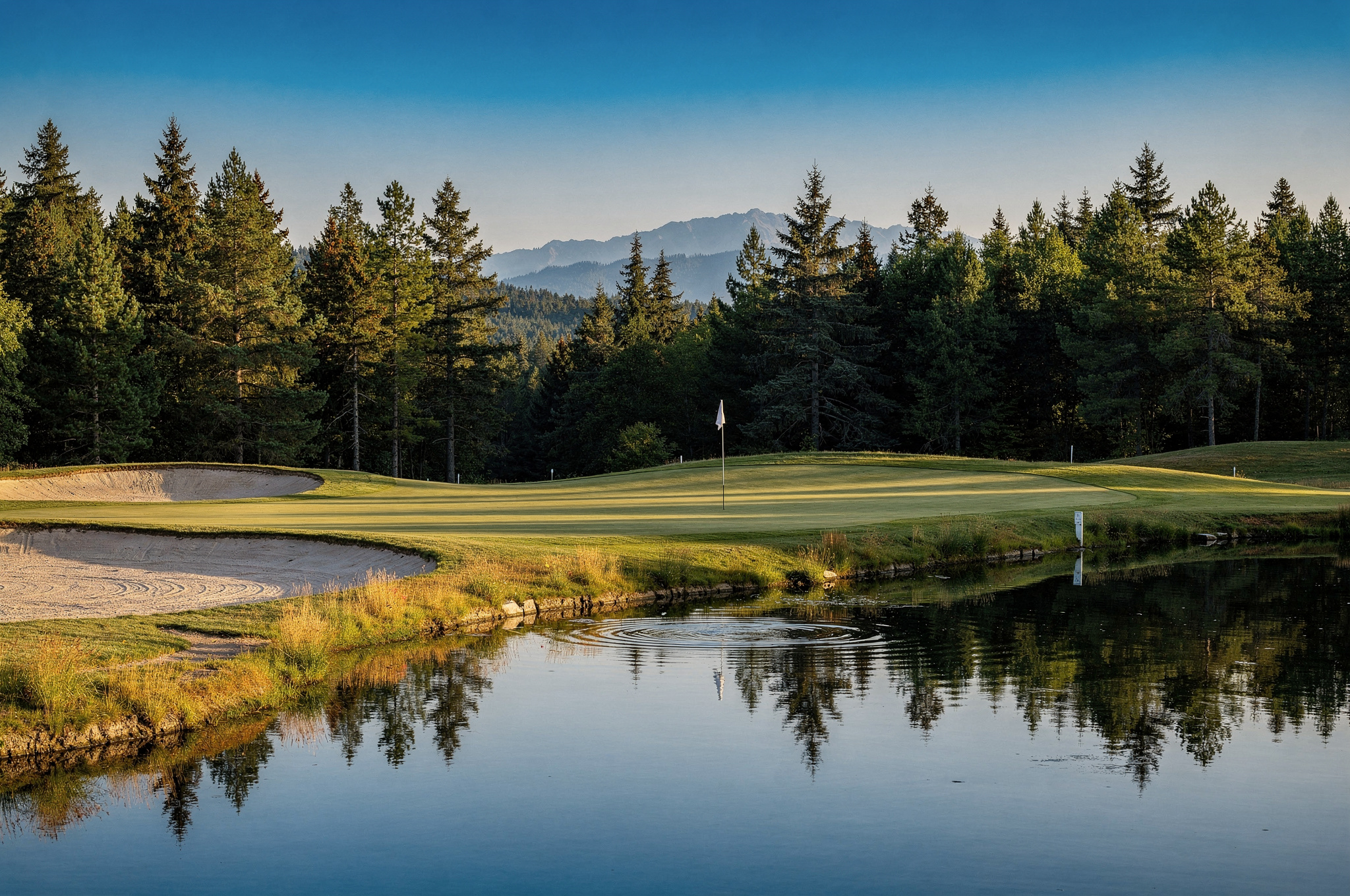 surreys varied public golf v2 Best Surrey Golf Courses Surrey BC public golf course green beside a pond with mountain views